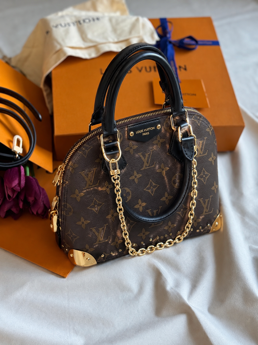 LV ALMA TACHES