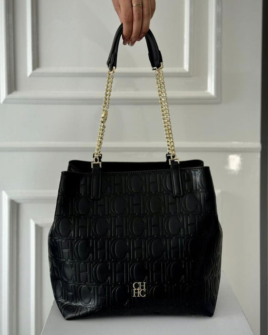 TULA CAROLINA HERRERA NEGRA.
